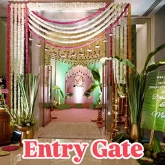 This elegant entry gate for a Teej celebration is decorated with garlands of white and pink flowers. A welcome sign written on a banana leaf adds a unique and traditional touch.