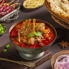 For The Mughal House, I created this dark and moody shot of Mutton Rogan Josh. The deep red curry, tender meat, and fresh garnishes are highlighted with dramatic lighting to create a rich, premium feel for their fine-dining menu.