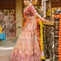 A full-length shot capturing the grandeur of a bridal lehenga. The makeup was crafted to be bold enough to stand out, yet elegant enough to feel timeless, ensuring the bride felt confident from her entrance to the final farewell.