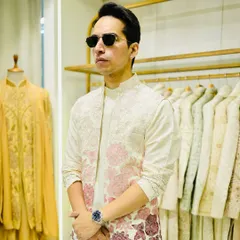 The front view of the off-white bandhgala, paired with a matching embroidered kurta underneath. The complete set is elegant and perfect for a day wedding or Mehendi.