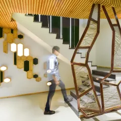 For the AMG Real Estate Office, I transformed a challenging basement space into a dramatic, modern lobby. The design uses an open-plan layout and a striking staircase to create a sense of openness and aesthetic harmony, setting a sophisticated tone from the moment of entry.