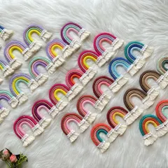 Rainbows everywhere. This image shows the wide variety of color combinations I can create for my macrame rainbow charms, from pastel palettes to bold and bright primary colors.
