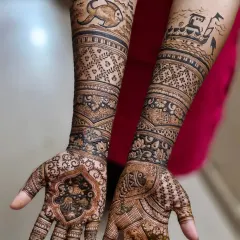 A unique Koli-themed mehendi for a bride from the fishing community. The design features elements like a fishing boat and fish, celebrating her cultural heritage.