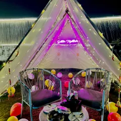 Our "Better Together" tent is a favorite for couples. It's a private, fairy-lit space on the lawn, perfect for celebrating your bond.