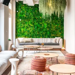 This is an example of a preserved moss wall we installed in a corporate lounge area. These living walls provide a stunning visual impact and improve room acoustics, all with minimal maintenance requirements, making them ideal for commercial interior design.