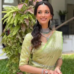 A beautiful three-quarter view of the minimal South Indian bridal makeup. The focus is on natural radiance, with subtle highlighting and soft definition that enhances her features without overpowering them.