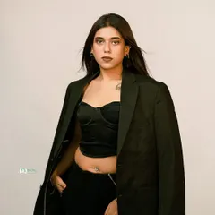 A modern, edgy look with a black corset and blazer. This studio shot is all about attitude, conveying strength and style for a contemporary fashion portfolio.