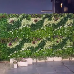 This large, custom patterned artificial vertical garden was installed at the famous Hawai Adda in Murthal. The design adds a dynamic and natural element to the restaurant's exterior.