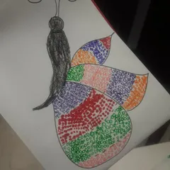 A beautiful butterfly created using a doodling art technique. This activity encourages patience and creativity, as kids fill the wings with intricate patterns and colors.