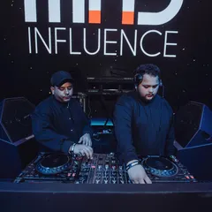 In the zone with my brother DJ Yoschi. We are completely focused on delivering a seamless and powerful set.