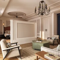This view shows the bedroom's integrated lounge area, separated by a clever floating TV wall. This design creates two distinct zones for sleeping and relaxing within a single, harmonious space, blending classic elegance with modern functionality.