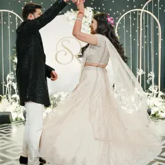 Sukriti and Rahul "dancing their way to forever" at their Sangeet. We designed a modern, chic backdrop with their monogram and geometric patterns, perfect for this stylish couple's celebration.
