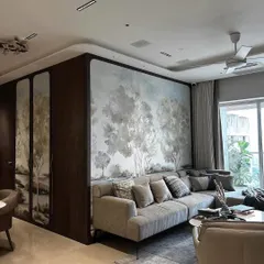 To create a seamless flow between the living and dining areas, I used framed artisanal wallpaper panels. This technique adds artistic flair while maintaining a cohesive and harmonious atmosphere throughout the open-plan space.