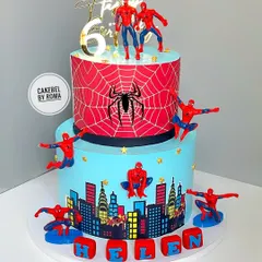 A two-tiered Spider-Man cake for a young superhero's 6th birthday. I had so much fun placing multiple Spideys swinging into action around the city skyline, making it an adventure from every angle.