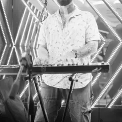 A live keyboardist adding his magic to the mix. Collaborating with live musicians brings a whole new layer of energy and showmanship to the party.
