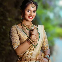 The full bridal ensemble, showcasing the rich texture of the Kanchi tissue saree and the detailed embroidery on the blouse.