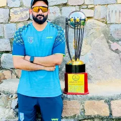 Standing with a championship trophy. This is the goal we work towards every single day, a symbol of dedication, teamwork, and relentless effort.
