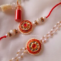 A closer look at one of my traditional Kundan Bhai Bhabhi sets. The intricate mirror work and red stone are set on a classic red thread for him and a delicate pearl chain for her.