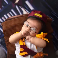 In love with this cute little Harry Potter. Even the tiniest wizards need a moment to think, and this little one is just too precious in his Gryffindor gear.
