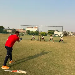 Fielding drills in progress. A sharp fielder saves runs and creates chances. We dedicate specific time to improve agility, catching, and ground fielding.