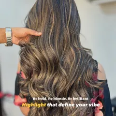 Be bold, be brilliant. We created these beautiful blonde highlights using a balayage technique for a seamless, sun-kissed effect. The soft waves really make the different tones pop.