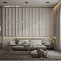 I believe a bedroom should be a luxurious retreat. Here, the floor-to-ceiling upholstered wall paneling creates a dramatic yet soft focal point. The layered neutral tones, plush fabrics, and ambient lighting come together to form a serene and sophisticated space designed for ultimate relaxation.
