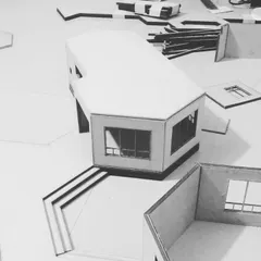 A physical scale model of a bungalow, a crucial tool in my design process. This work-in-progress shot shows how I use models to study the building's form, proportions, and relationship to the contoured landscape.