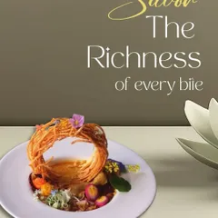 Savor the richness of every bite. This dish, with its intricate potato nest and garnish of edible flowers, is an example of how we craft food to be a feast for the senses.