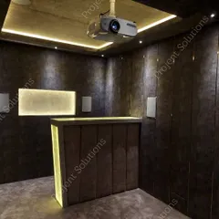 A duplicate image showing the technical setup of a home theater, including the projector and speaker placement.