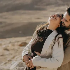 The pure joy and laughter of Shreya and Shubham during their pre-wedding shoot in the rugged terrain of Leh-Ladakh. This candid moment captures their adventurous spirit and deep affection.