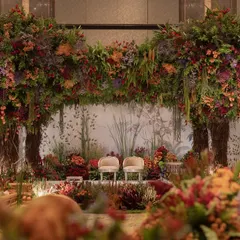 The breathtaking 'Orchard of Life' we created indoors for a baby's naming ceremony. Towering, handcrafted trees with floral canopies and a custom botanical backdrop turned a banquet hall into a sacred, enchanted forest.