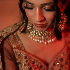 A soft and romantic makeup look for an engagement ceremony. The focus is on glittery eyes and glowing skin, creating a dreamy and elegant look for the bride-to-be.