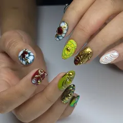 A true work of art on every nail. This set features a vibrant mix of colors and textures, with 3D sculpted elements, gold details, and jewel-like accents, showcasing our most creative and high-fashion designs.