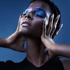 A beauty portrait where the makeup tells a story. The iridescent blue eyeshadow is the hero, and I used a soft but directional light to make the colors pop against the model's skin.