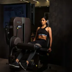 The leg extension machine is perfect for isolating and strengthening the quadriceps. We incorporate targeted machine work like this to build well-rounded muscle definition.