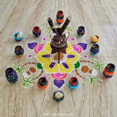 For the Sankranti festival, I painted a collection of terracotta pots and arranged them around a colorful rangoli. It was a fun way to celebrate the harvest festival with art.