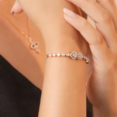 Wrap yourself in elegance that speaks your style. Discover timeless charm with our handcrafted diamond bracelets, like this delicate heart-motif piece.