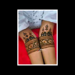 The initial startup design on the arms, featuring majestic elephants under royal umbrellas. This sets the tone for a grand and traditional bridal mehendi.