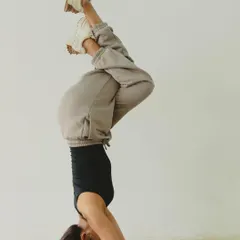 Another playful headstand variation, finding a moment of balance and joy. The focus is not on perfection, but on the feeling within.