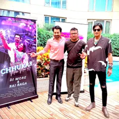 Another shot from the launch event for the "Chhukar Mere Man Ko" remix. Standing next to the official banner, this photo represents the successful collaboration and release of the track.