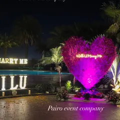 A key feature of my proposal decorations is this large heart-shaped structure made of purple flowers. It includes a custom neon sign saying "Will U Marry Me" and is beautifully lit to be the centerpiece of your special moment.