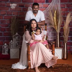 Family is not just an important thing, it's everything. This classic family portrait against a rustic brick wall is a timeless keepsake.