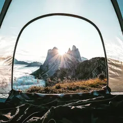 Imagine waking up, unzipping your tent, and being greeted by this. The sun breaking through the peaks, a sea of clouds below you. I find these special hillside spots so you can have a front-row seat to Mother Nature's morning spectacle.