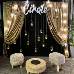 We can transform any space for a modern festive party. For this Diwali celebration, we created a chic photo booth with golden drapes, hanging candle-lit jars, and rustic jute seating, perfect for capturing stylish memories.