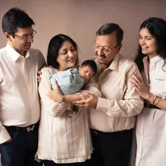 The whole family gathered to admire the tiny new addition. I love capturing these gentle, adoring gazes that show the deep love surrounding a newborn.