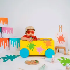 This little artist is too cool for school. Adding fun sunglasses gives this painter-themed setup a playful and modern twist, showing off the baby's personality.