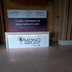A custom-built reception desk for the Mono Implant exhibition stall. This served as the primary point of contact for visitors, featuring clean branding and a professional finish to make a strong first impression.