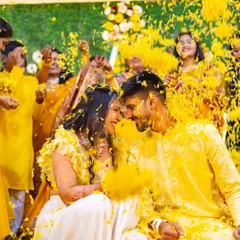 The Haldi ceremony is pure, unfiltered joy. My team and I position ourselves to capture the energy from every angle, ensuring we get these vibrant, action-filled shots that you will cherish forever.