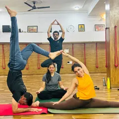 Our community is the heart of our studio. We create intricate group poses like this one not just for the physical challenge, but to build connection, trust, and share a few laughs along the way.