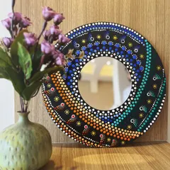 This stunning spiral dot mandala mirror was handcrafted in one of my workshops. It's a perfect example of how you can create a beautiful and functional piece of home decor, even as a beginner.